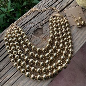 Gold tone multi layer necklace set